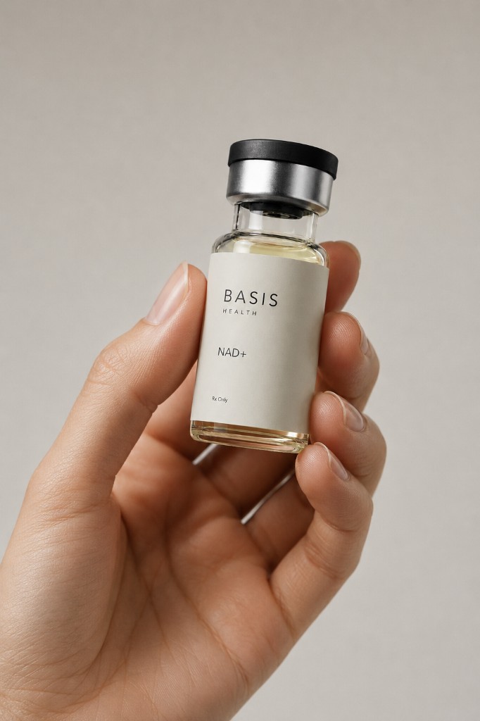 Hand holding Basis Health NAD+ prescription vial